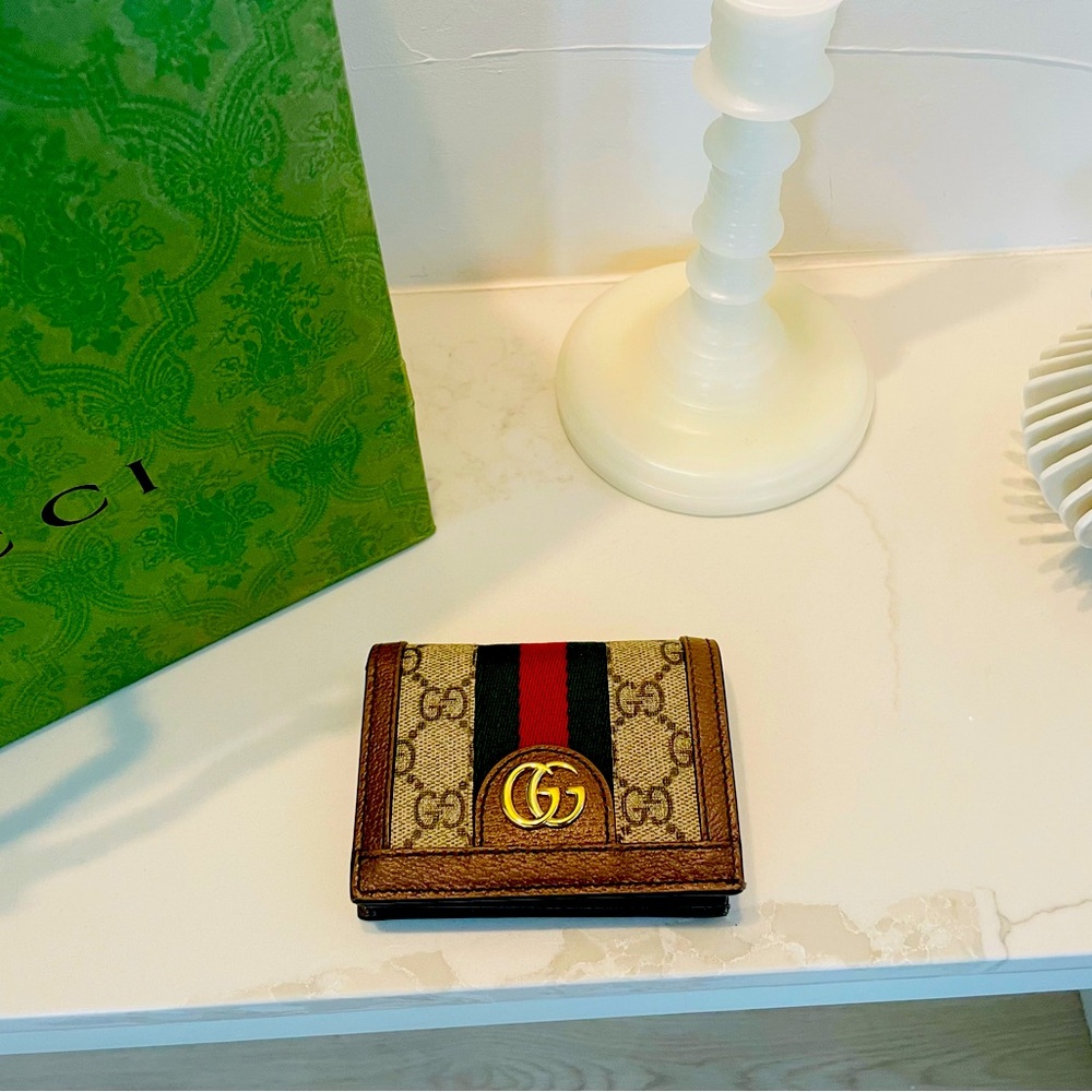 Small women's Gucci wallet brown tan GG canvas pattern bi- fold